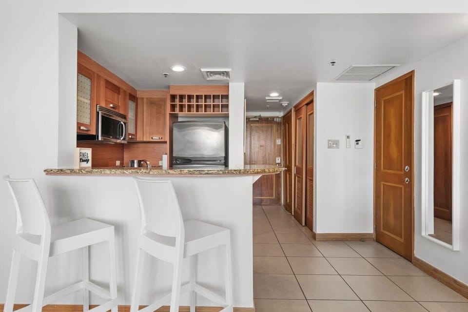 The kitchen offers seating for 2 with two stools