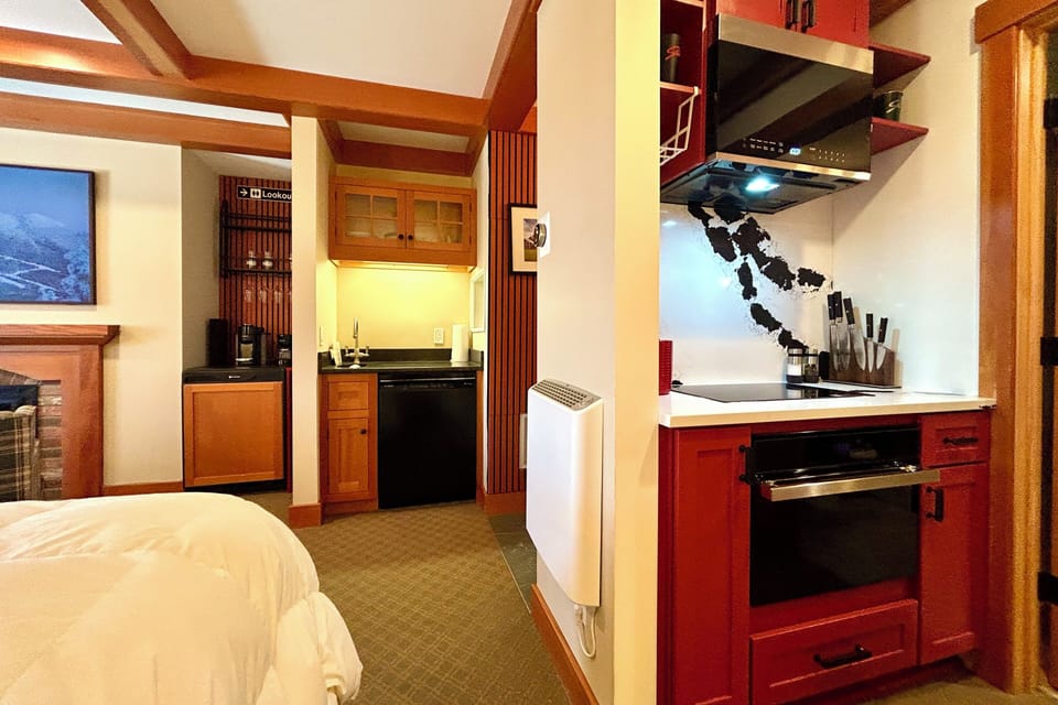 1st floor king suite: kitchen, dining, dishwasher, balcony, frame tv, etc.