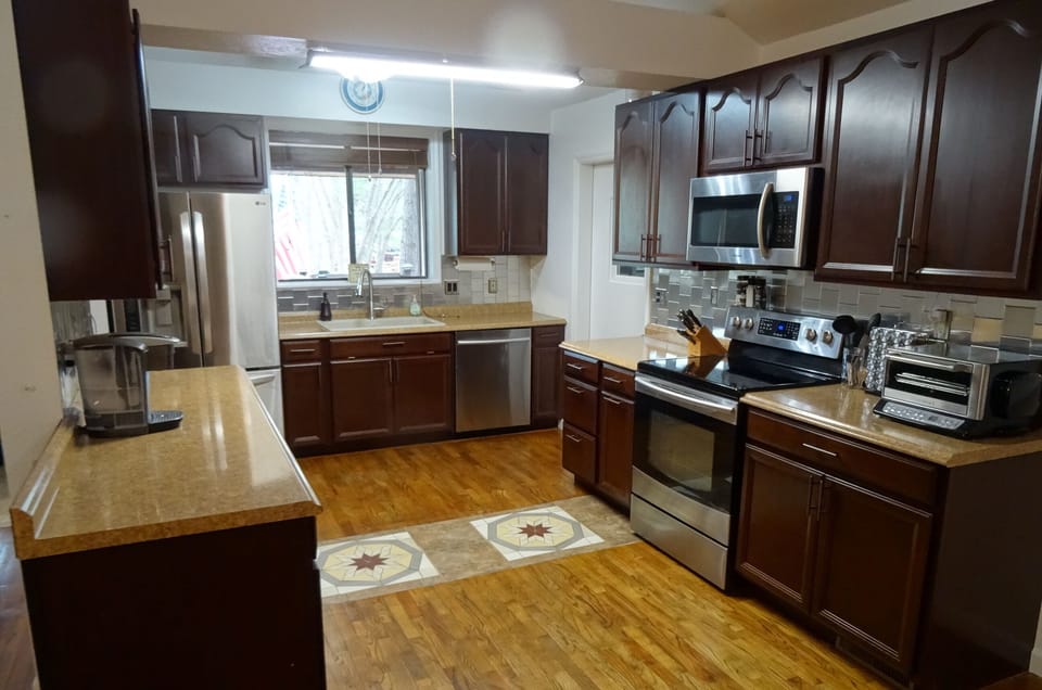 Updated kitchen stocked with everything you could want for large family meals.