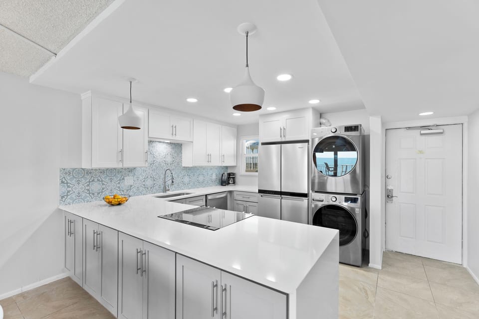 Whip up a dinner in this sleek, fully equipped kitchen while chatting with loved ones at the breakfast bar.