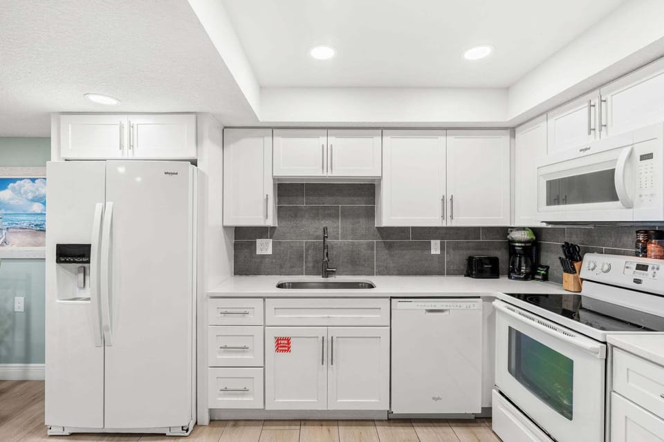 Fully-equipped kitchen with ample space for preparing delicious meals and enjoying family time.