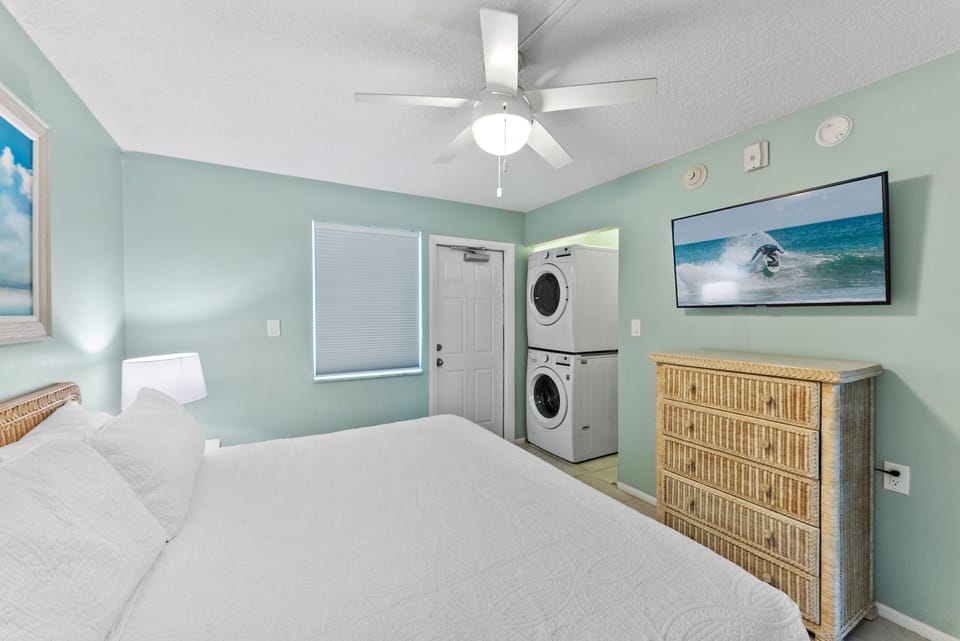 Stylish guest bedroom featuring a laundry area
