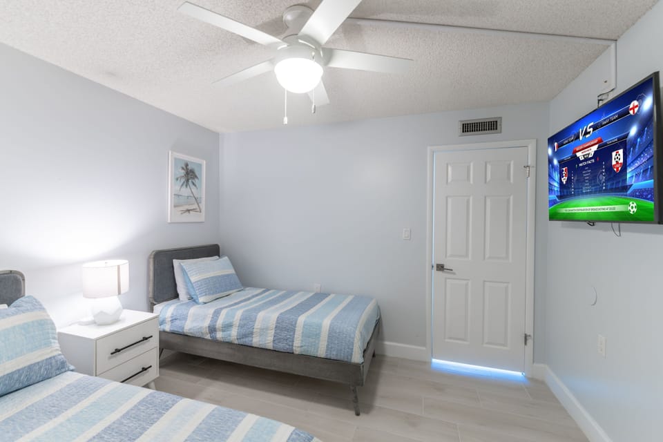 Unwind and watch your favorite shows in the guest bedroom