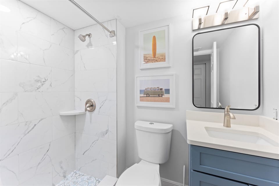 Guest bathroom with with walk-in shower.