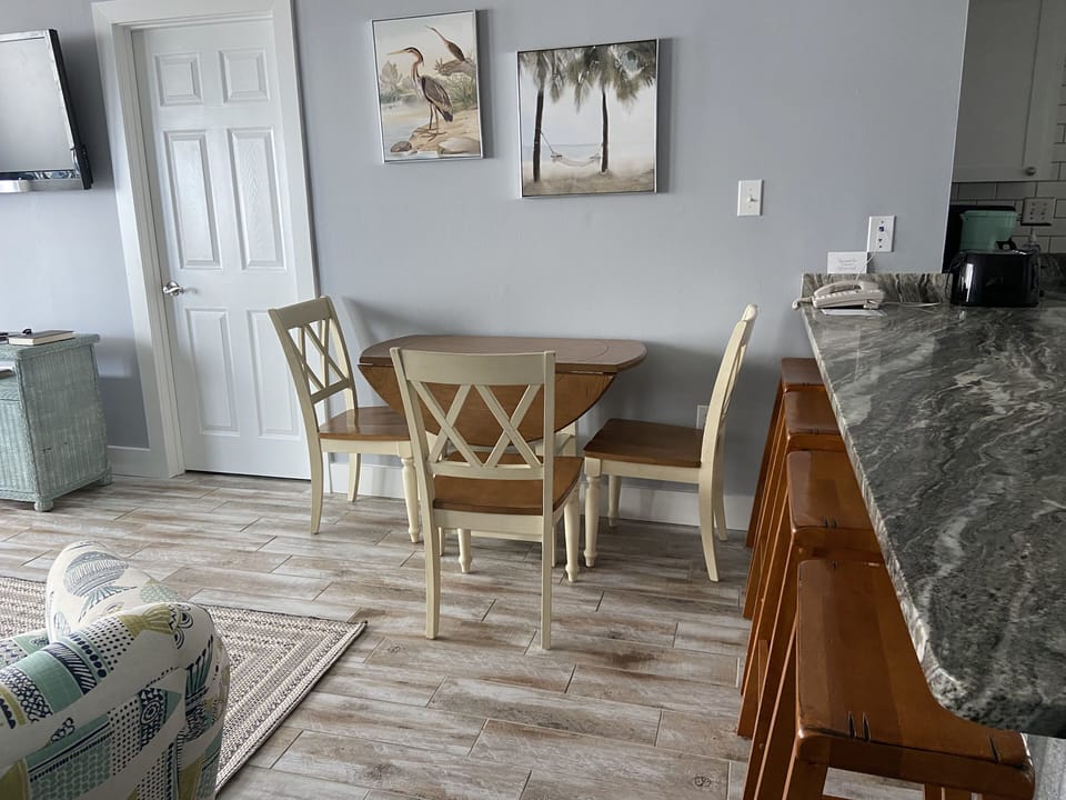 Dining area along with bar sitting
