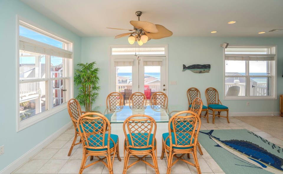 Dining table w/ 8 chairs and 2 more if needed.  View the ocean while eating.