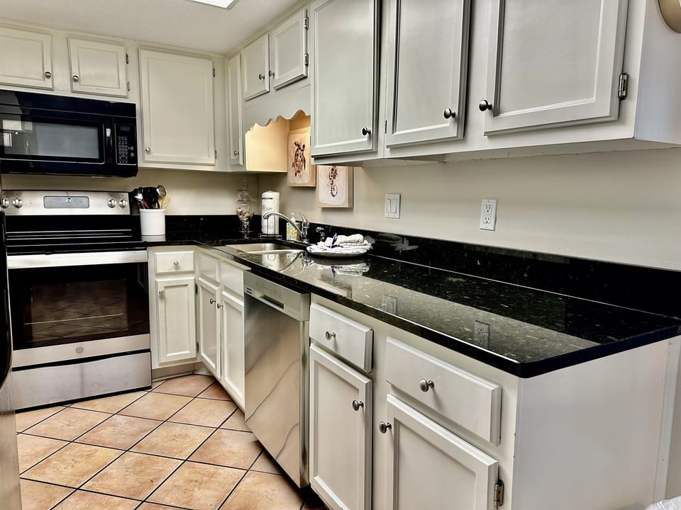 Fully stocked kitchen with pots and pans, dishes, glassware etc....