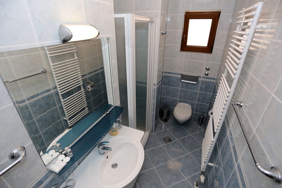 Comfort Studio Suite, 1 Bedroom, Balcony, Sea View | Bathroom | Shower, free toiletries, hair dryer, slippers