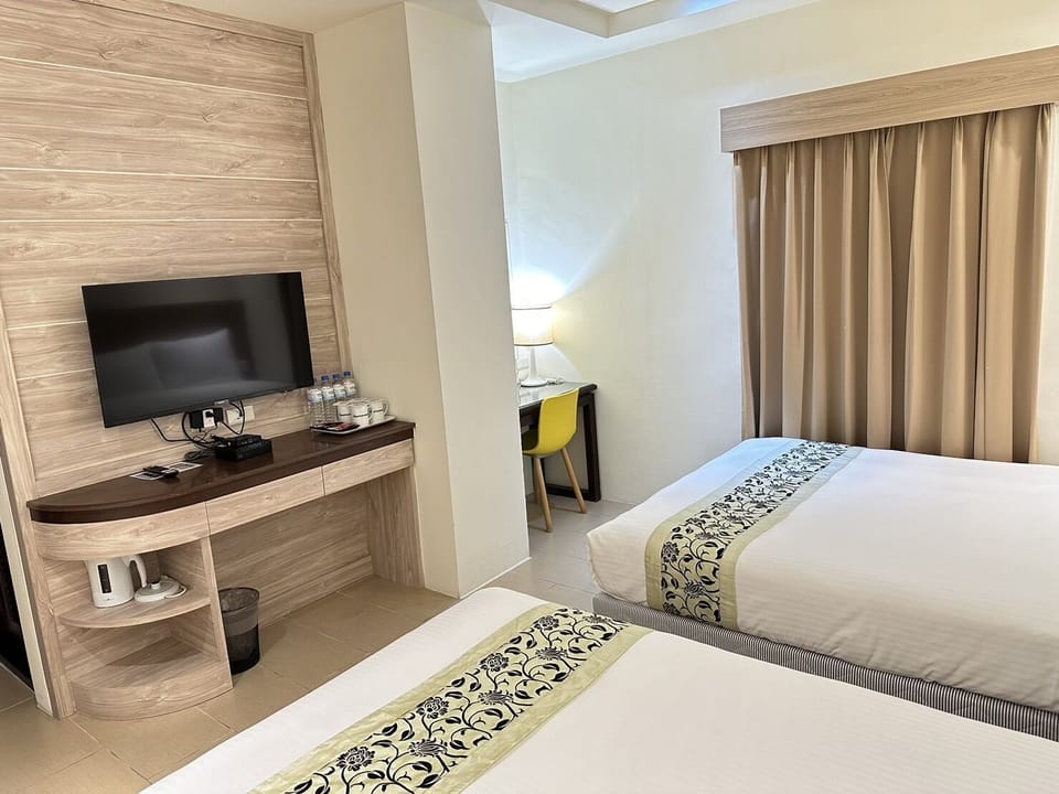 Family Quadruple Room | Living area | LCD TV