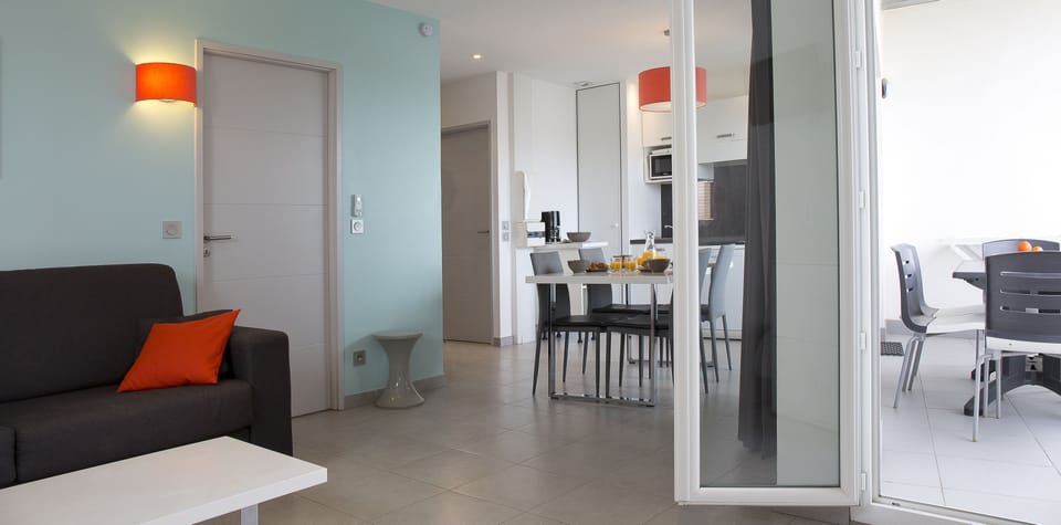 Superior Apartment, 1 Bedroom, Sea View | Living area | 72-cm flat-screen TV with satellite channels, TV