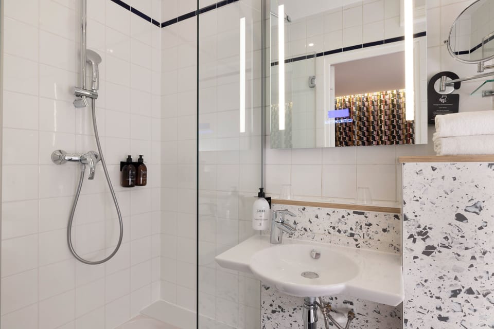 Shower, eco-friendly toiletries, hair dryer, towels