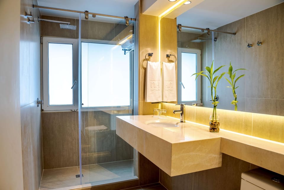 Shower, rainfall showerhead, designer toiletries, hair dryer