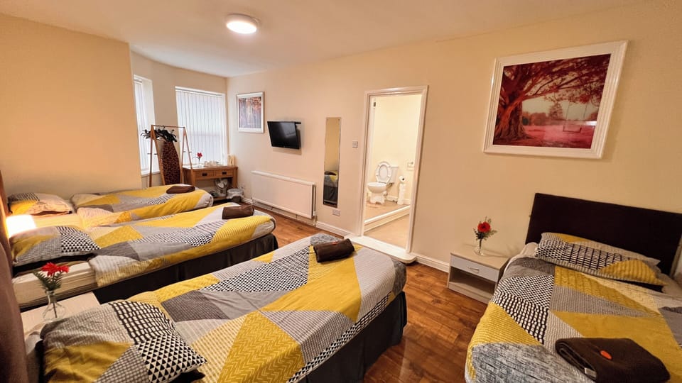 Family Room, Private Bathroom (Sleeps 4) | Individually decorated, iron/ironing board, free WiFi, bed sheets