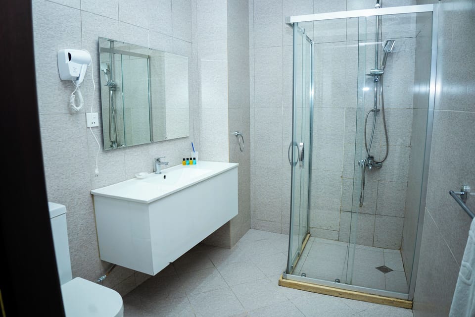 Standard Double Room | Bathroom | Shower, free toiletries, hair dryer, slippers