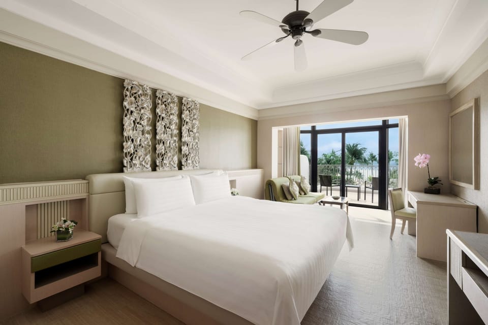 Deluxe Pool View King Room | Hypo-allergenic bedding available, in-room safe, desk, laptop workspace