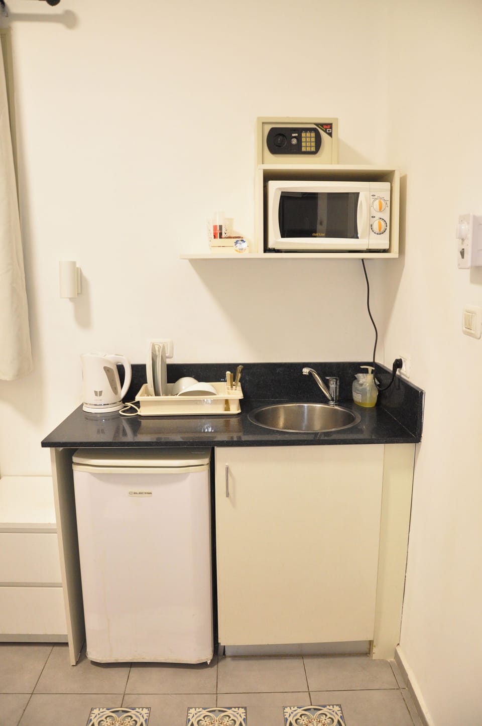Fridge, microwave, electric kettle, cookware/dishes/utensils
