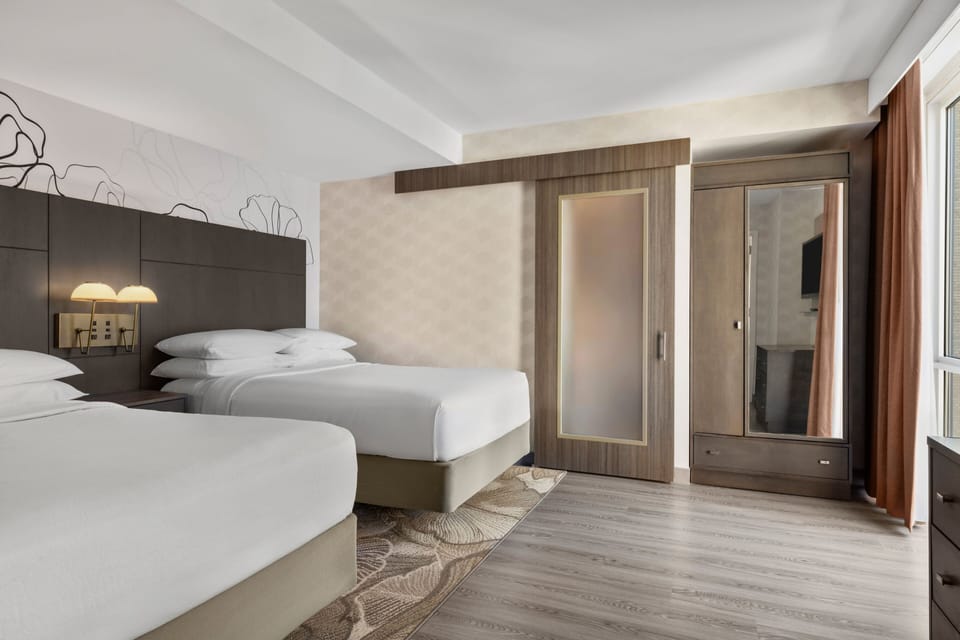 Premium bedding, down comforters, in-room safe, desk