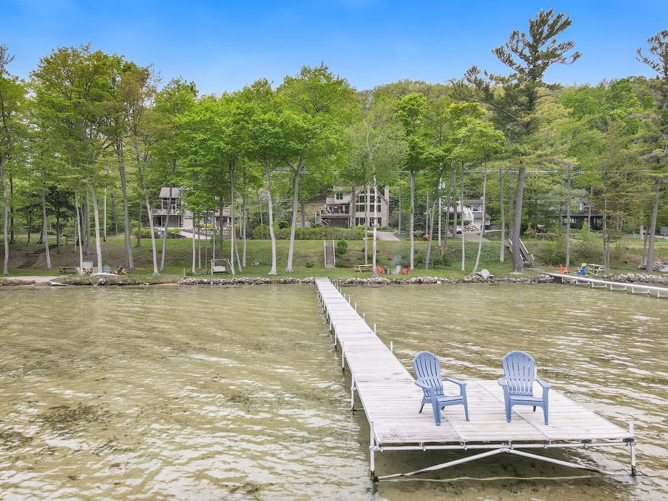Dock over sandy shallow water. 