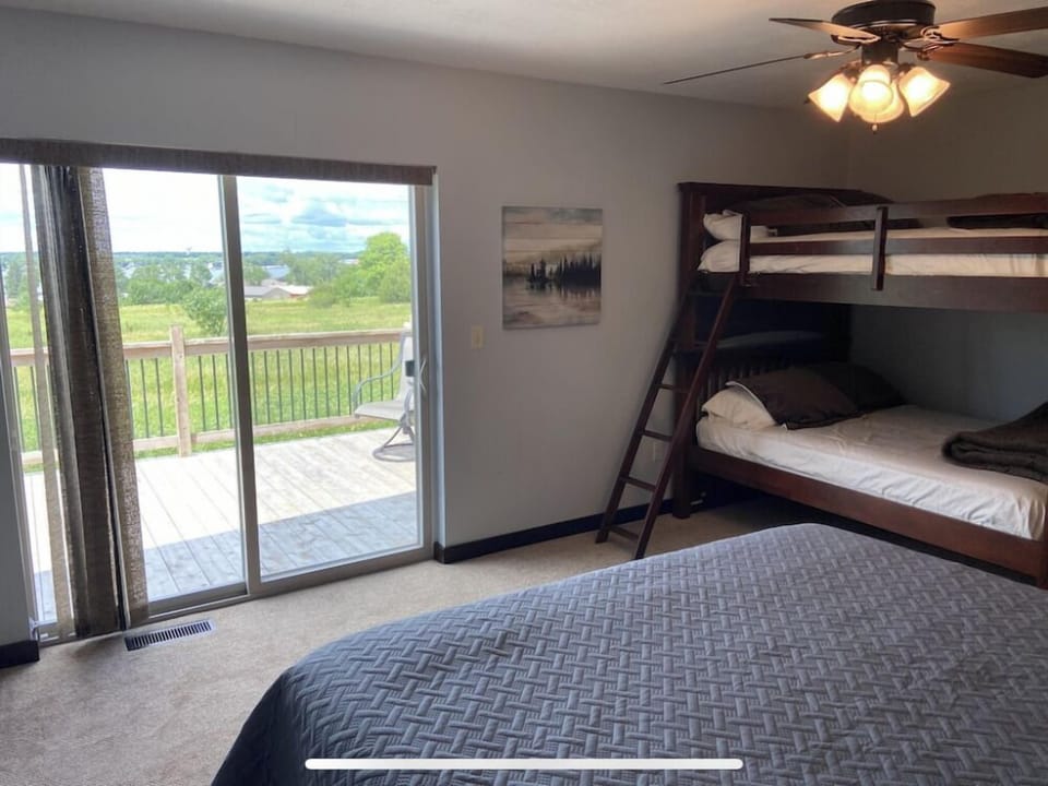 Master with king bed and bunk. Sliding door to upper deck.