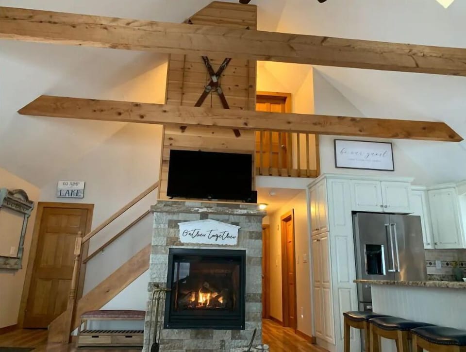 Main level living room - open concept kitchen, vaulted ceilings, gas fireplace 