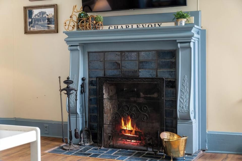 Historic fireplace and comfortable seating in the living room