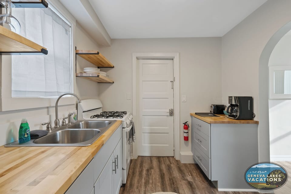 Kitchen facing entrace/exit to unit