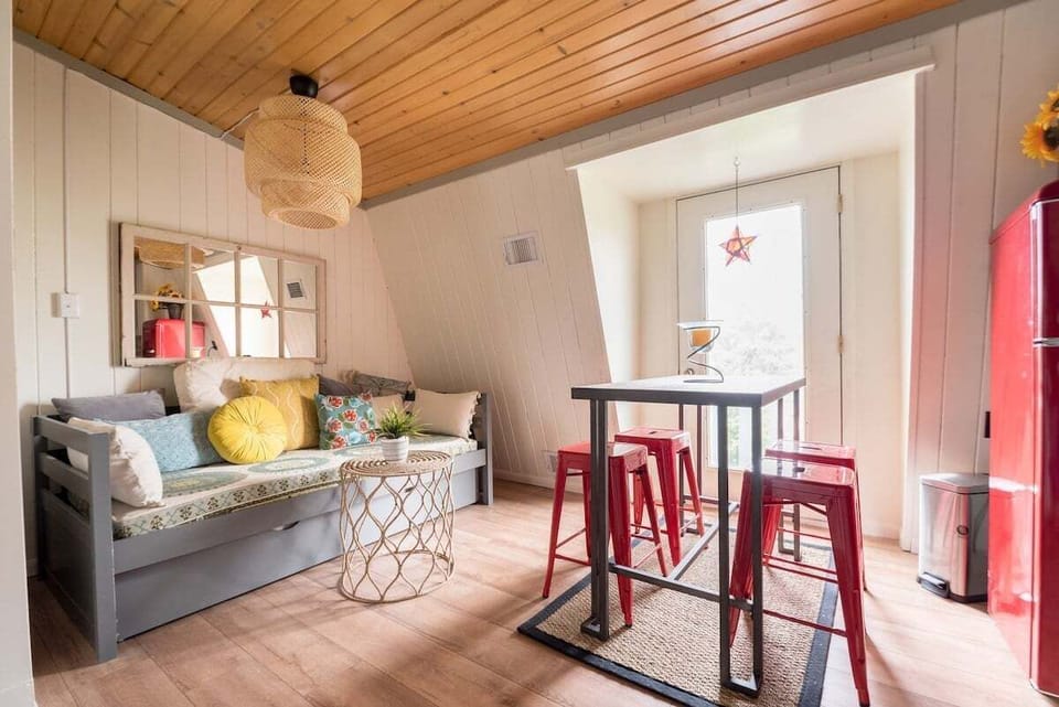 Living area with flat screen smart TV and twin daybed with trundle