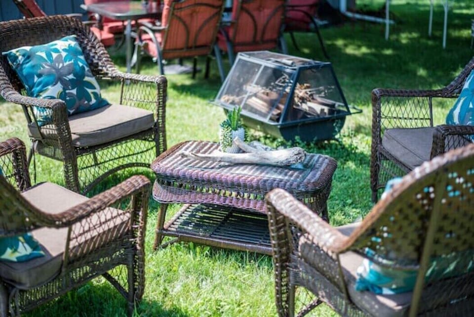Communal outdoor seating area in large backyard