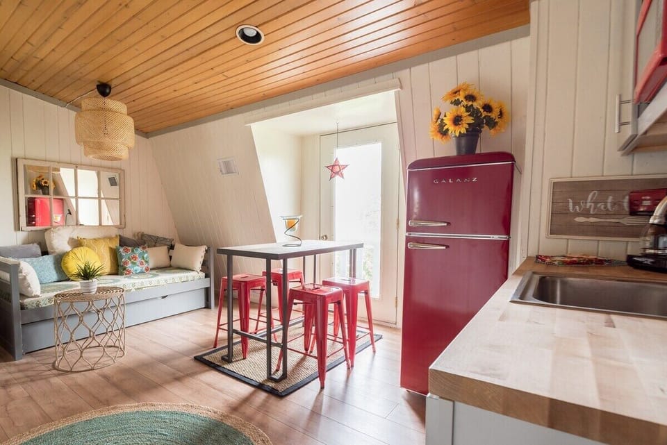 Living room/dining area with twin daybed with trundle