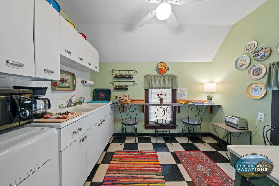 Cozy retro kitchenette with coffee maker, microwave, mini fridge and toaster (no stove).