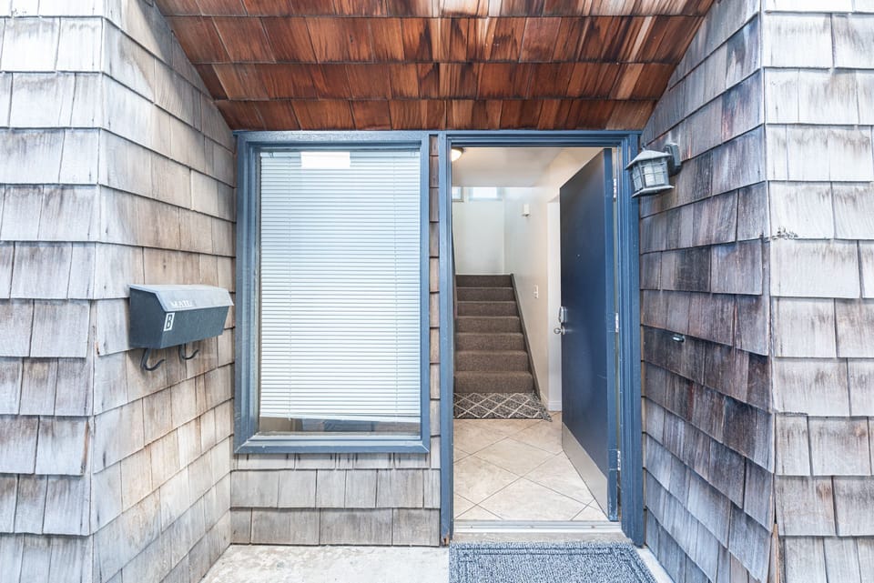 The entrance of the home is located on the side of the building. Due to the moderate climate, this home, like most in the area, does not include central air.
                