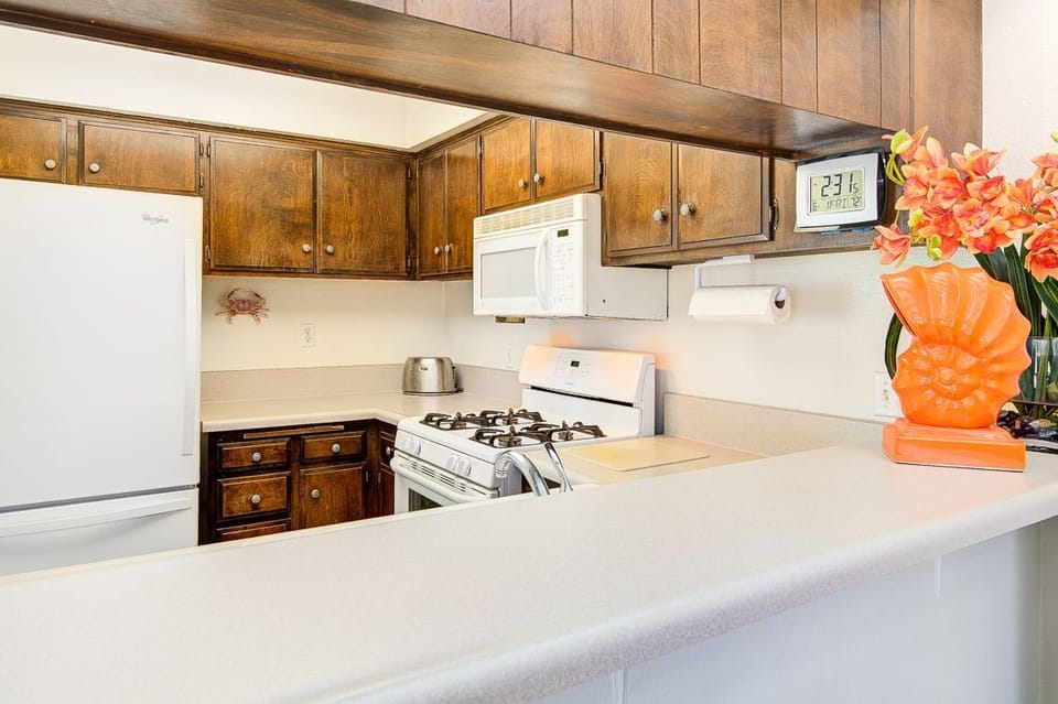 The kitchen opens out to the living area, making meal prep a social affair!
                