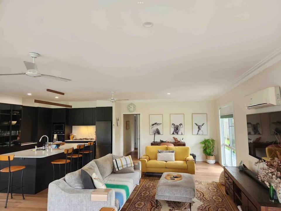 Living area with beautiful view,  entertainment area, dining and modern kitchen