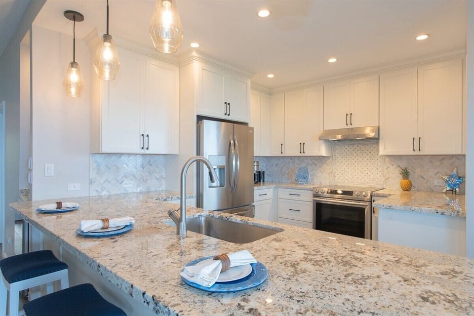 The breakfast bar features three comfortable stools