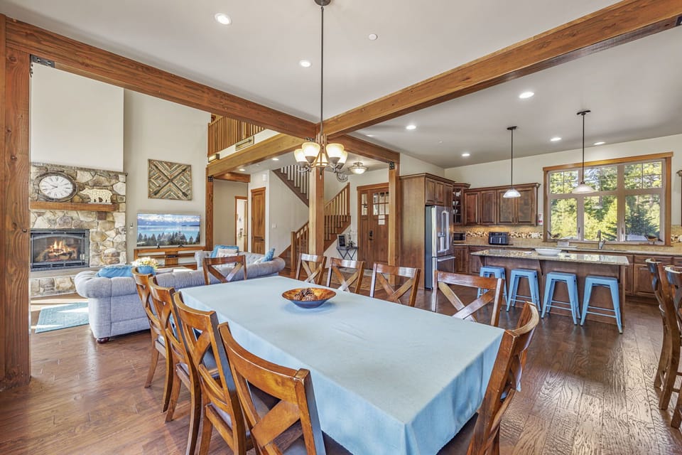 Spacious dining setup with artisan lighting and seamless connection to kitchen.