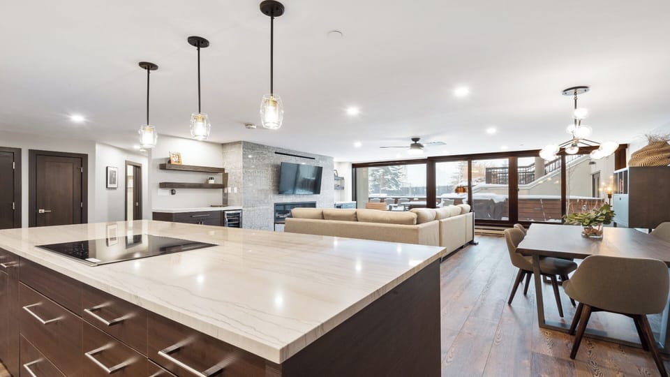 Step into your spacious, light-filled retreat where modern design meets comfort. The gleaming kitchen, cozy living area, and dining space flow seamlessly together, inviting you to relax and make yourself at home.