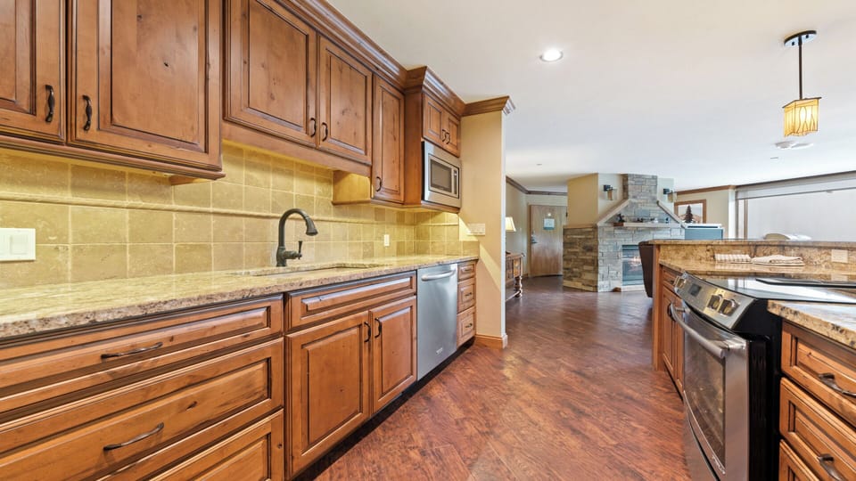 Step into your gourmet kitchen, fully equipped with granite counters, stainless appliances, and ample cabinet space—ready for your favorite recipes and morning coffee rituals.