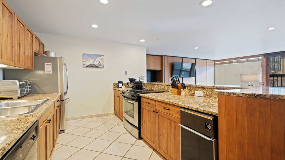 Your fully equipped kitchen awaits with granite countertops, stainless appliances, and everything you need to cook up memorable meals during your stay.