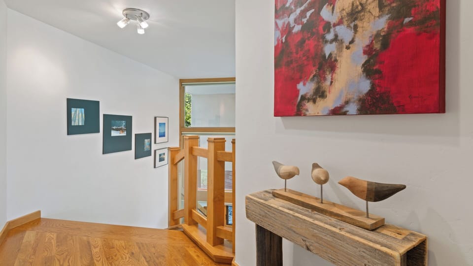 Step into an artful hallway where vibrant paintings and sculptural accents set a creative, welcoming tone for your stay—each detail thoughtfully chosen to inspire.