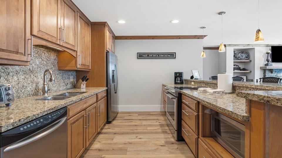 Picture yourself preparing meals in this spacious kitchen with granite countertops, stainless appliances, and abundant cabinet storage—everything you need to feel at home.