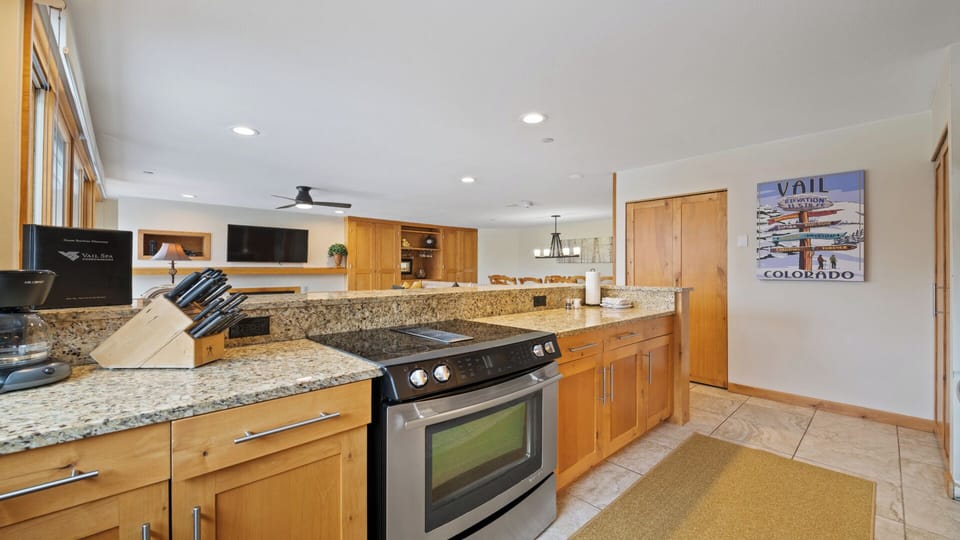 Your spacious, well-appointed kitchen features gleaming granite countertops, modern appliances, and warm wood cabinetry—perfect for preparing meals and gathering with loved ones.