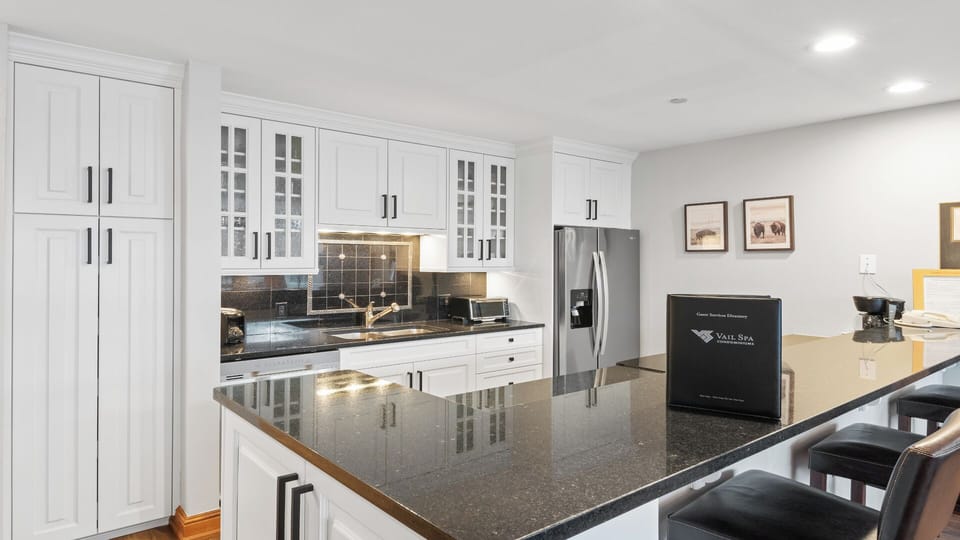 Your fully equipped kitchen awaits with gleaming granite countertops, modern appliances, and everything you need to whip up delicious meals during your stay.