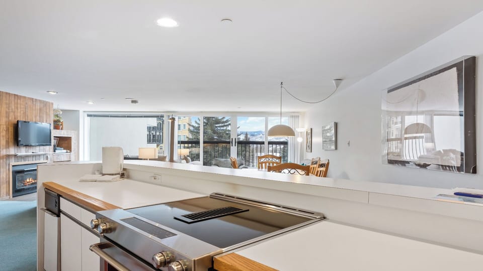 Cook effortlessly in your bright, open kitchen with mountain views. Stainless appliances and ample counter space make meal prep a joy while you connect with loved ones.
