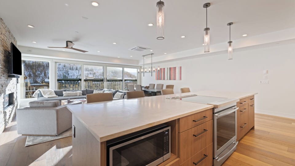 Your open-concept retreat blends modern elegance with mountain charm. Gather around the spacious island, relax by the fireplace, or savor scenic views through panoramic windows.