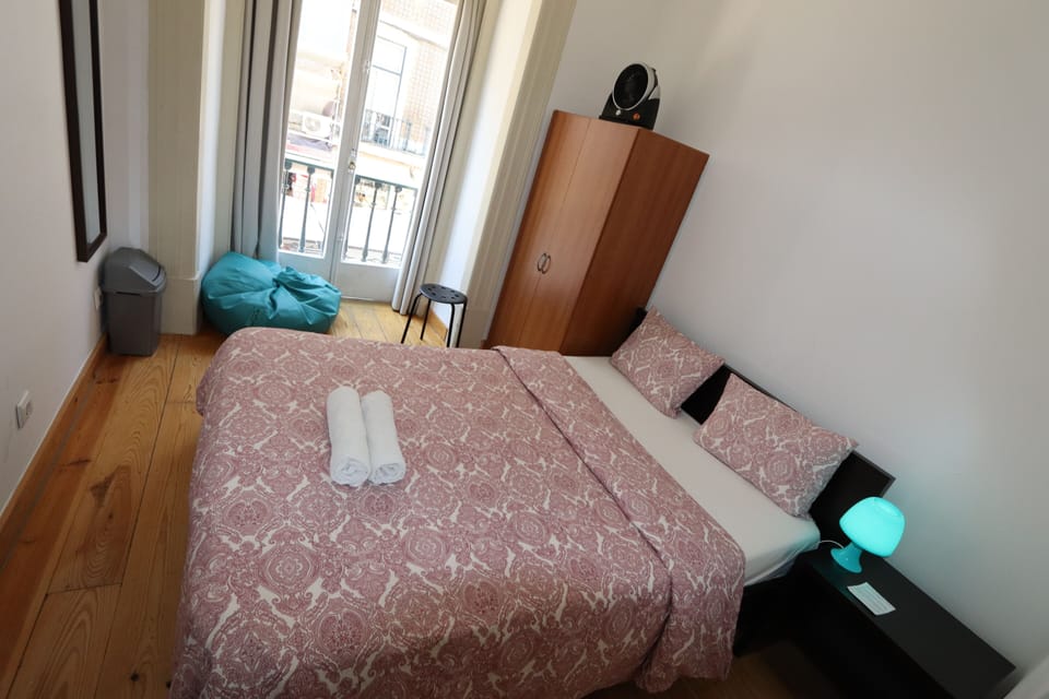 Basic Double Room, Shared Bathroom, City View | Iron/ironing board, free WiFi, bed sheets