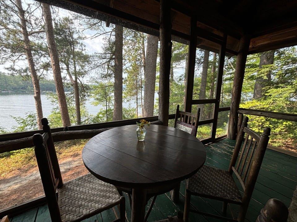 eating area on deck that overlooks lake