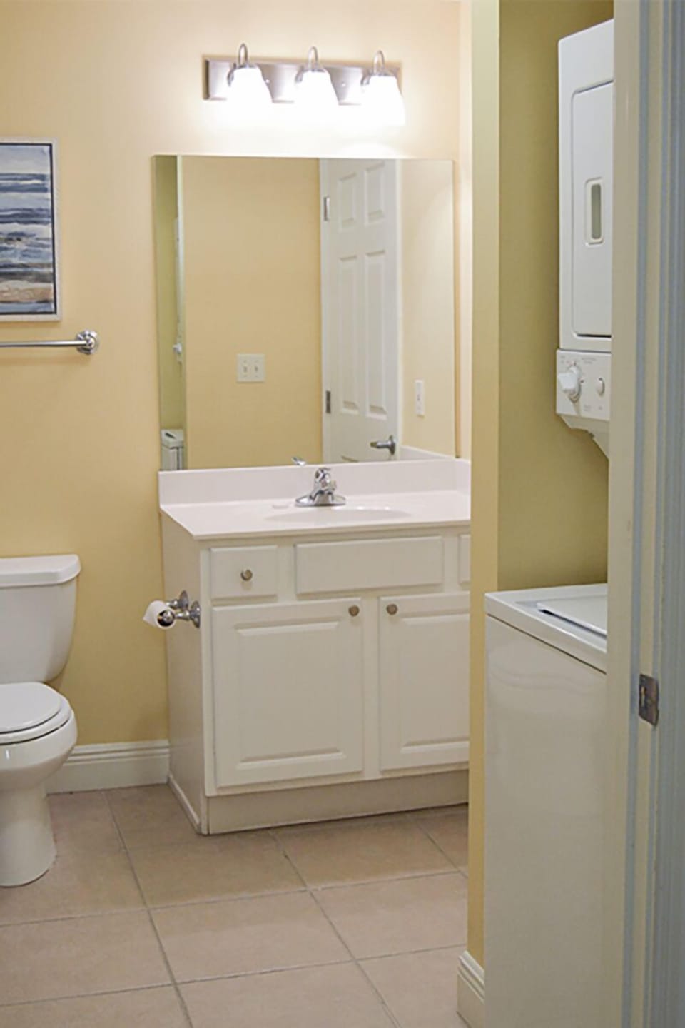 Full bathroom with laundry area
