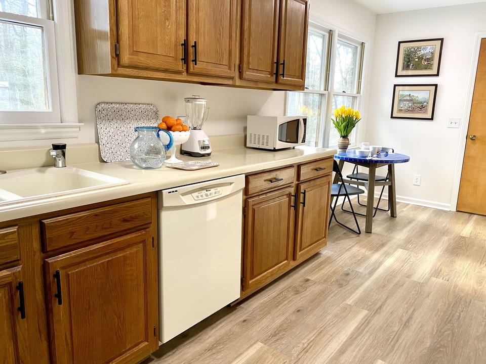 The large kitchen space includes a small breakfast nook for morning coffee