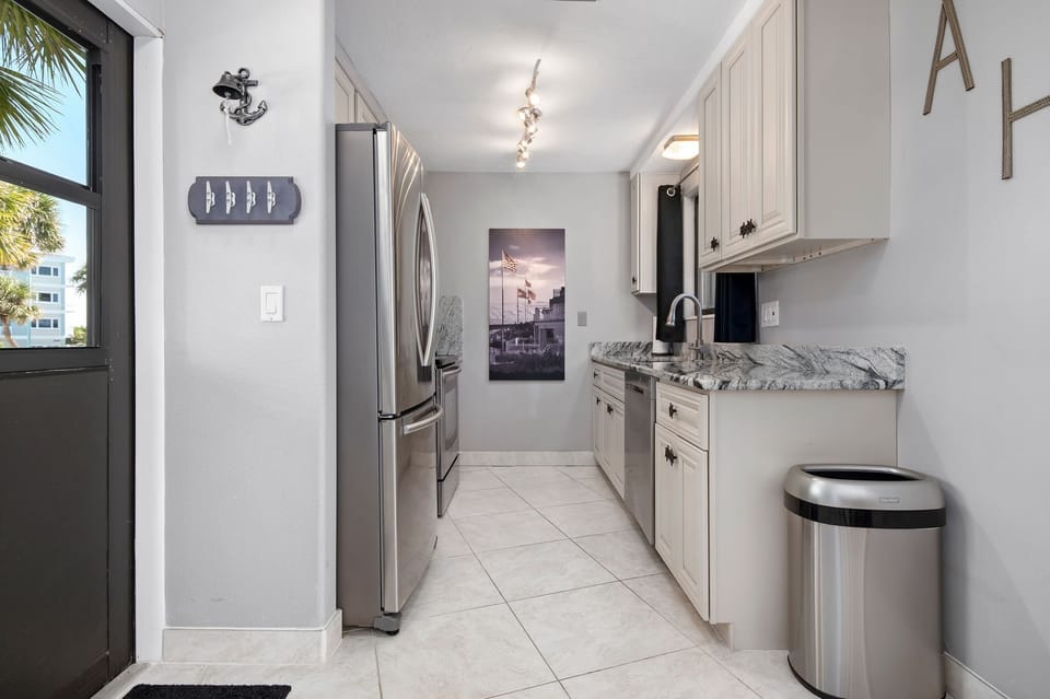 updated kitchen with dishwasher, kruerig, ice maker, toaster