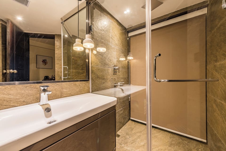 Shower, rainfall showerhead, designer toiletries, hair dryer